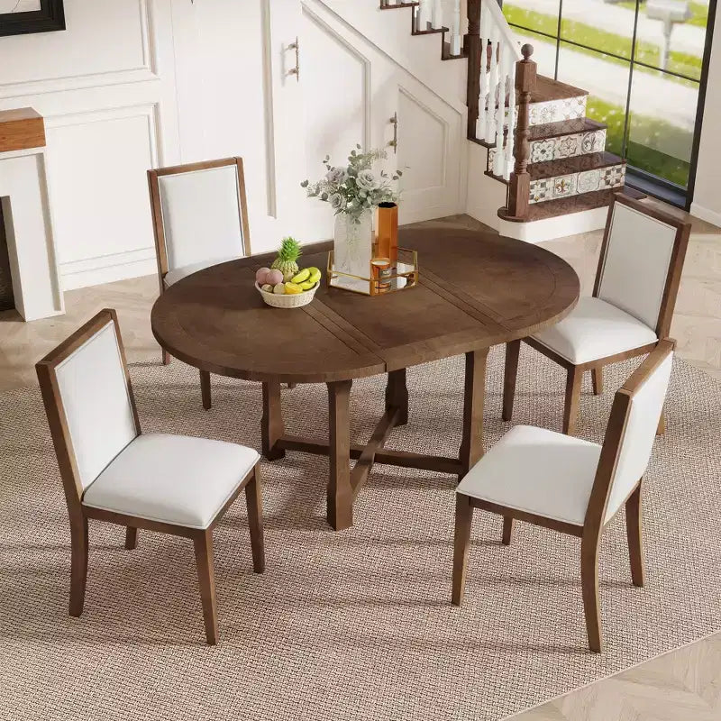 Ensemble de salle à manger 5 pièces Judith GDFStudio avec table ronde extensible et chaises rembourrées
