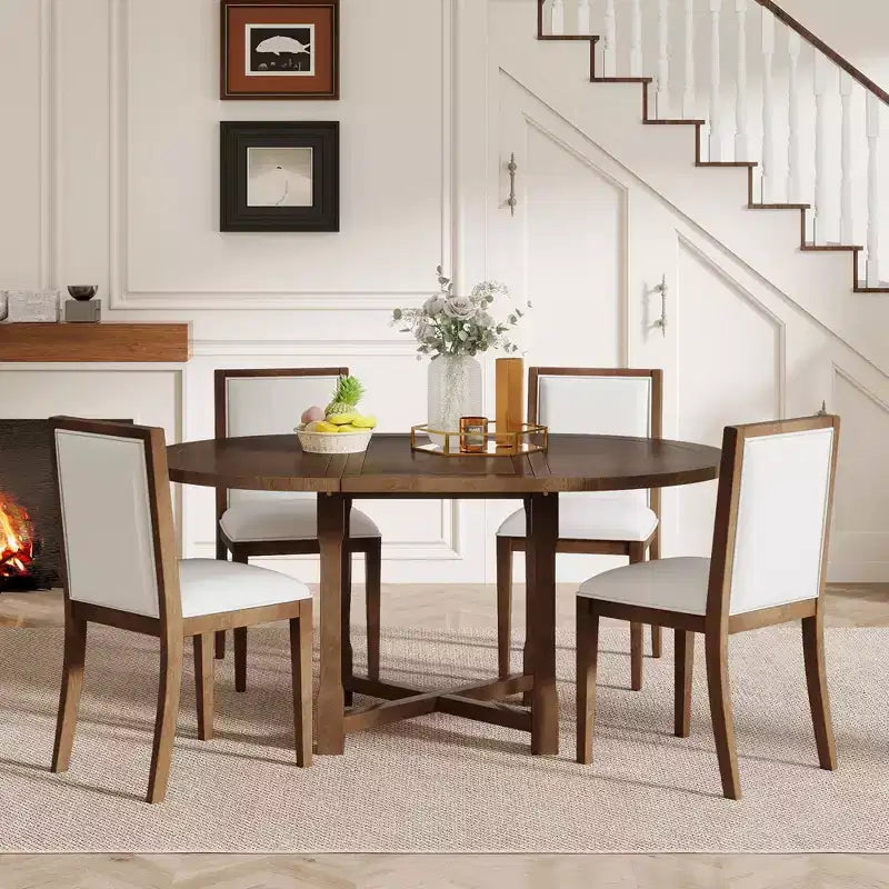 Ensemble de salle à manger 5 pièces Judith GDFStudio avec table ronde extensible et chaises rembourrées